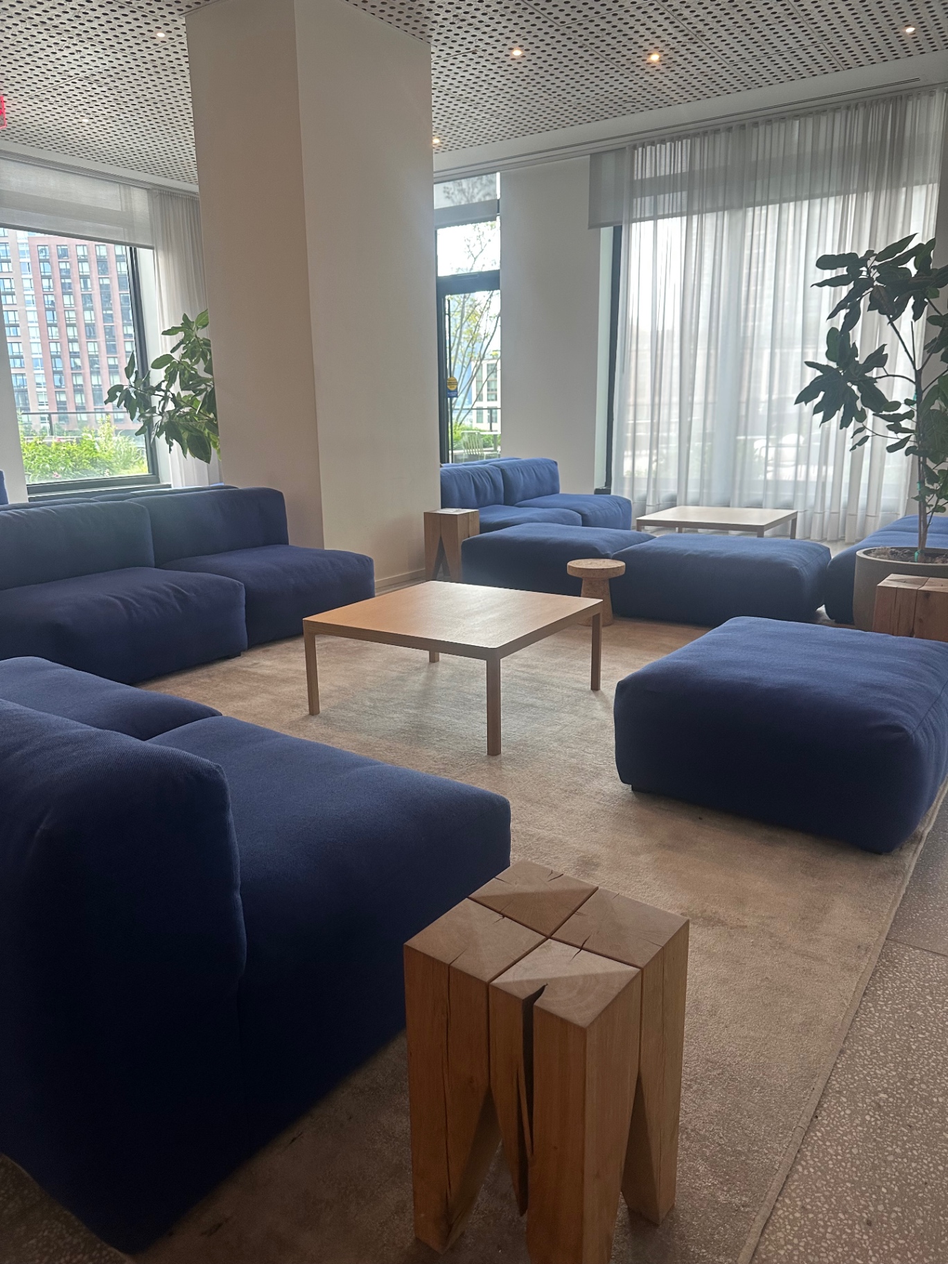 Soft seating and low tables inside the coworking lounge
